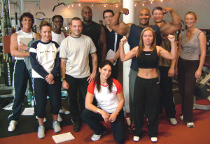 A happy group of students on a GB Fitness Personal Trainer qualification course - including Jet from TV's Gladiators and professional body builder Len St Cyr.